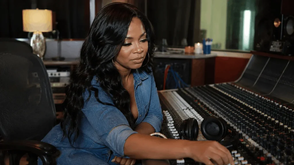 Ashanti in the studio, part of the income behind her net worth