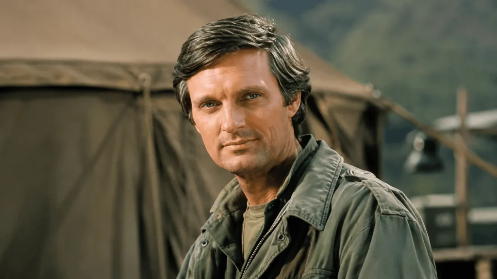 Young Alan Alda performing improv comedy on stage