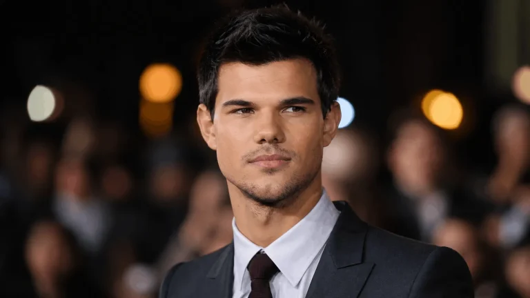 Text: Taylor Lautner net worth photo of the actor in 2026